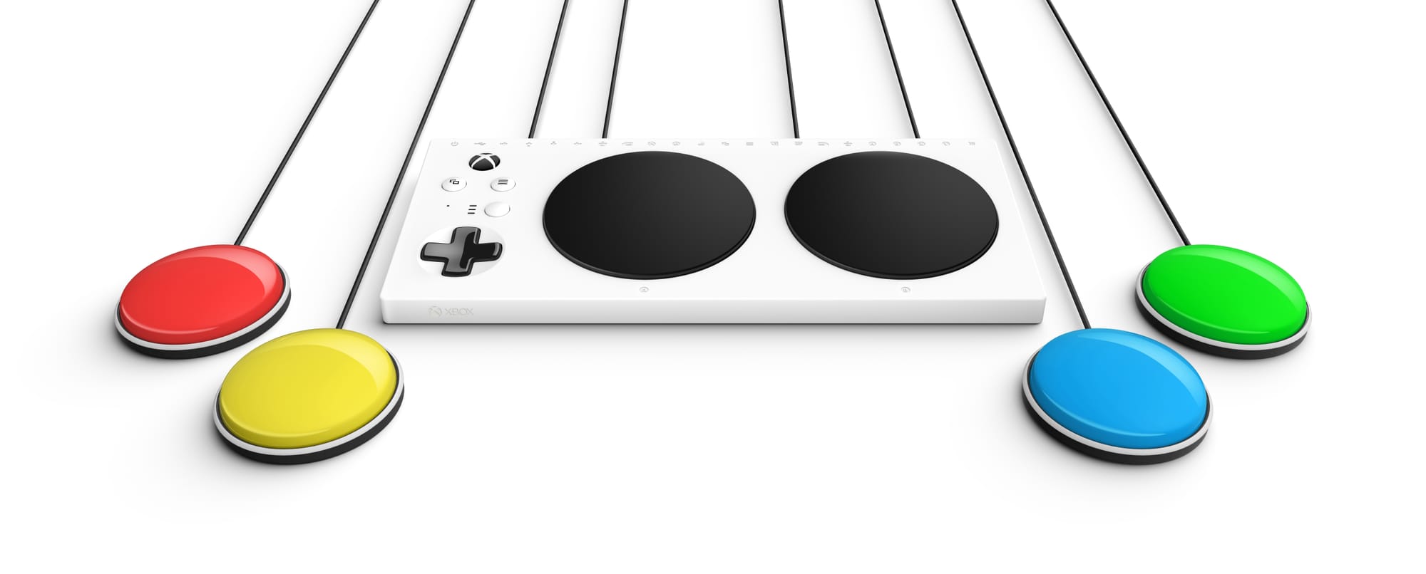 Xbox adaptive controller, center, with multi-colored buttons to both sides.