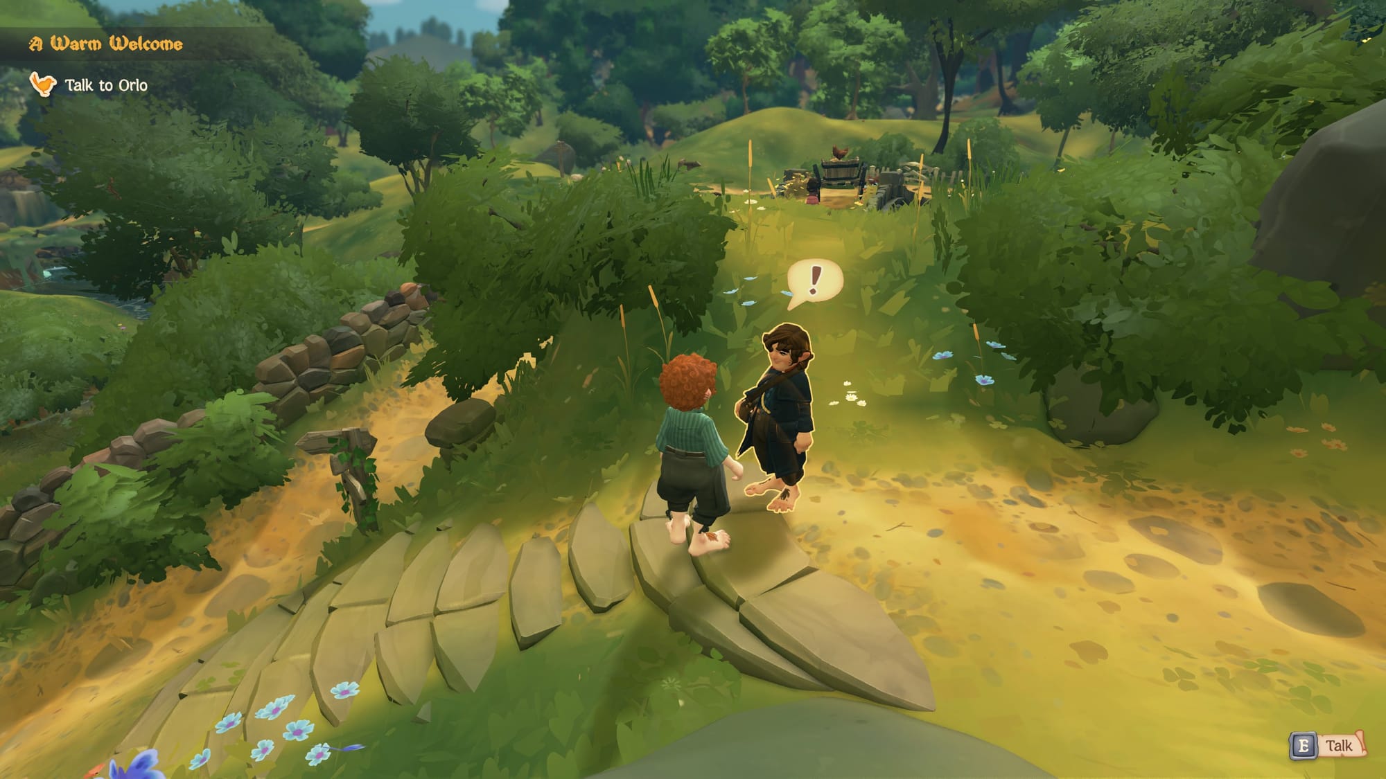 Tales of the Shire gameplay showing two hobbit characters meeting on a stone bridge in a lush green landscape, with 'A Warm Welcome' and 'Talk to Orlo' quest objectives visible and a talk prompt in the UI.