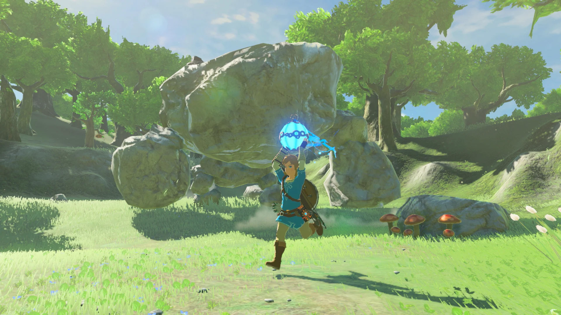 Breath of the wild screenshot, link runs from rock golem "malus" holding a blue bomb, green grass and trees surround.