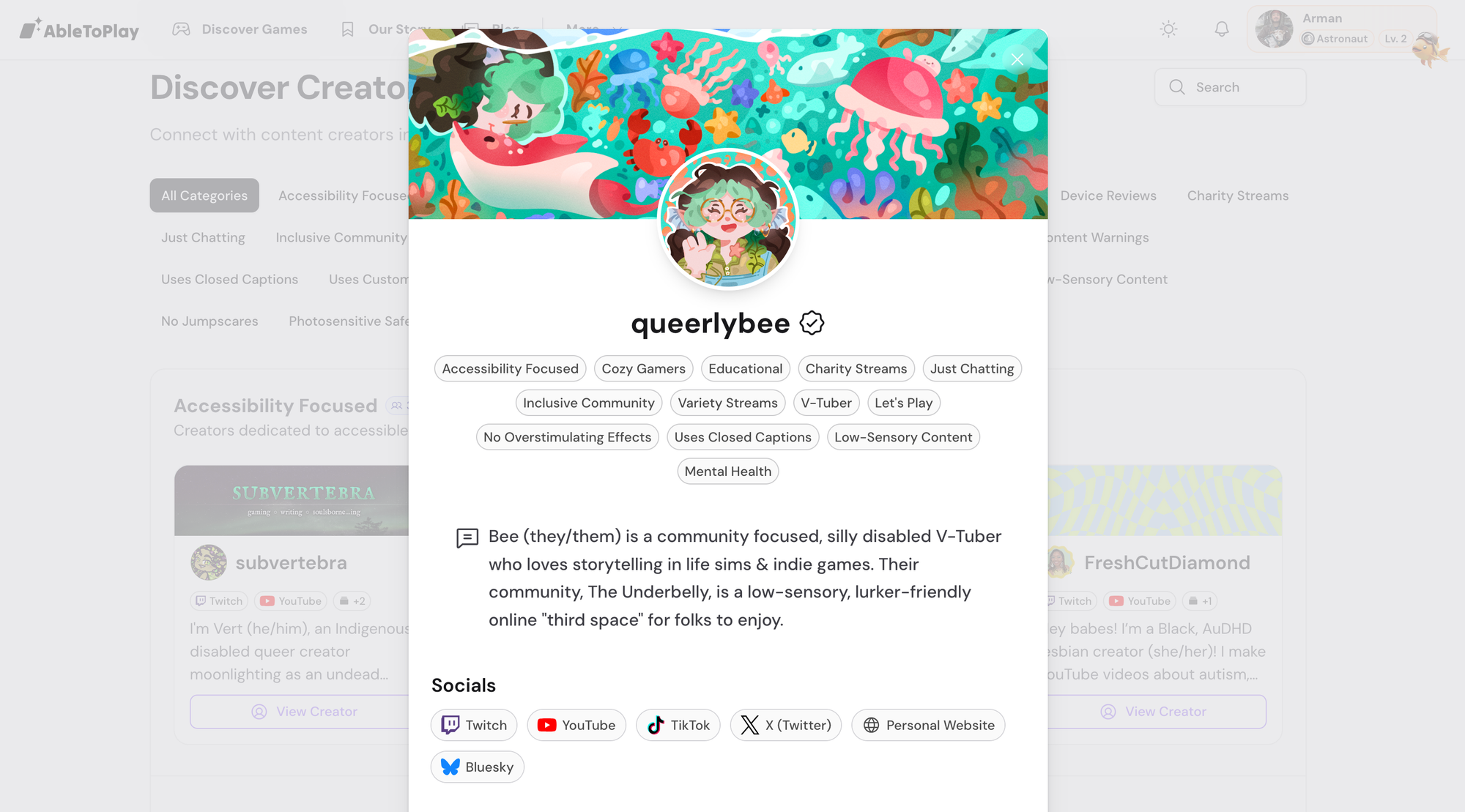 Creator profile for "queerlybee" showing banner image, avatar, many categories, and bio sections.